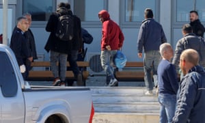 People rescued during the raid are taken to police headquarters in Heraklion on the island of Crete.