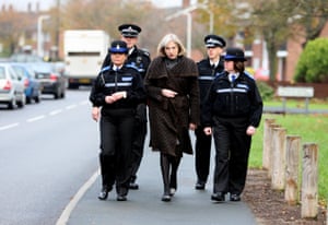 May, then home secretary, walks with Essex police officers during a visit to Chelmsford in 2010