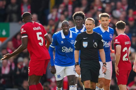Konate argues with referee Craig Pawson.
