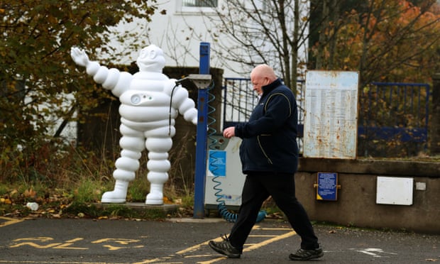 a worker leaves Michelin’s Dundee tyre factory
