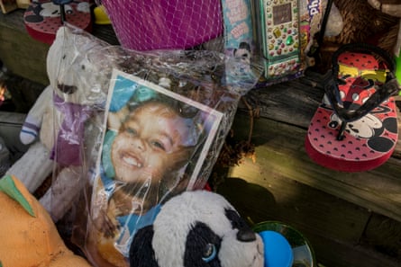 A memorial for 3-year-old Kennedi Powell is seen outside her grandmother’s house in south St Louis. The toddler was killed while outside the house in June of this year in a drive-by shooting