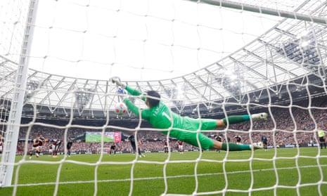 West Ham United’s Lukasz Fabianski saves a penalty from Manchester City’s Riyad Mahrez.