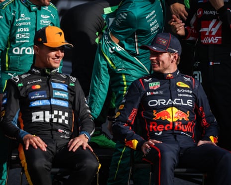 Max Verstappen checks in on Lando Norris during this morning’s photo call.