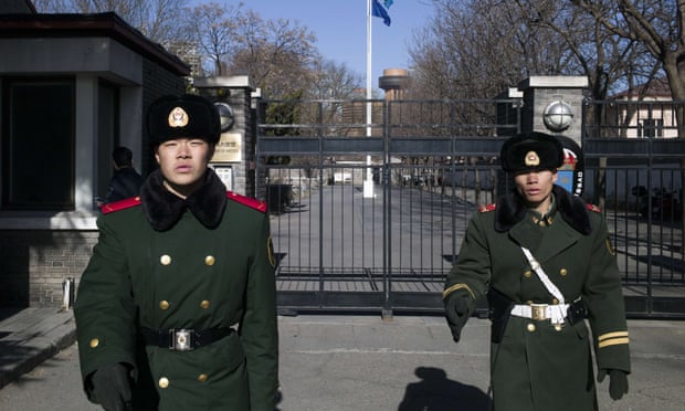 Paramilitary guards stand in front of the gates of Sweden’s embassy in Beijing on Wednesday