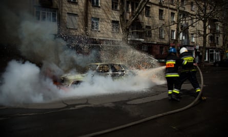 A civilian car ablaze following an alleged Russian bombing in the southern city of Mikolaiv in April