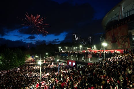 A general view as fans of Arsenal celebrate outside the Emirates as Arsenal are confirmed as Premier League champions.