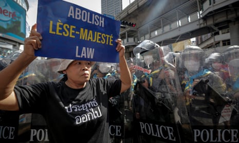 A protester holds a sign calling for an end to the lese-majesty law in Bangkok in November.