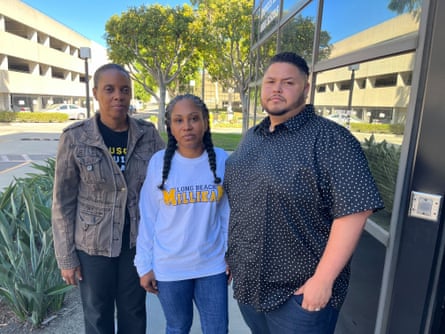 Two women and a man pose for a picture