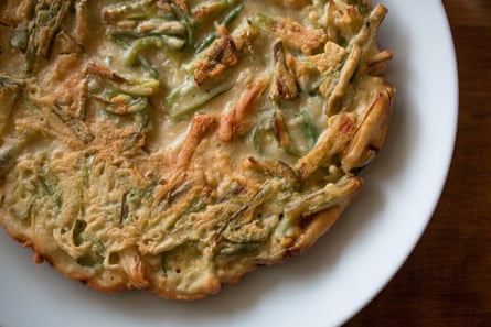 A grilled pancake with seafood, called haemul pajeon