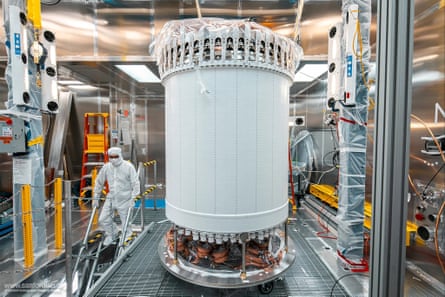 A dark matter detector, which is cylindrical in shape, in a lab before installation in the underground facility.