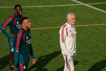 José Mourinho with Ferlan Mendy and Kylian Mbappé on the pitch at the Bernabéu