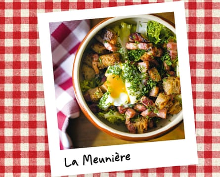 An overhead instant photo of a dish of bacon, egg, lettuce and chunks of bread, against a red gingham tablecloth