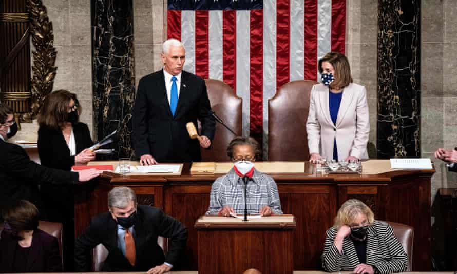 Mike Pence and Nancy Pelosi preside over a joint session of Congress to certify the 2020 electoral college results after a mob stormed the US Capitol on 6 January.