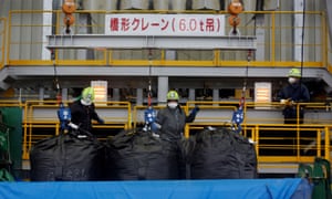 Workers at a soil separation facility for decontamination work in Okuma