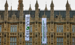 Protesters calling for a halt to the Heathrow airport expansion unfurl banners on the Houses of Parliament in 2008. 