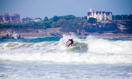 A surfer tackles a big wave at Playa de Loredo near Bilbao.