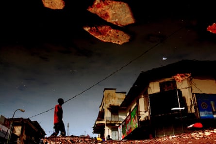 Shimmering street life … one of Kiripi Katembo’s ‘puddle’ photographs, Evolution.
