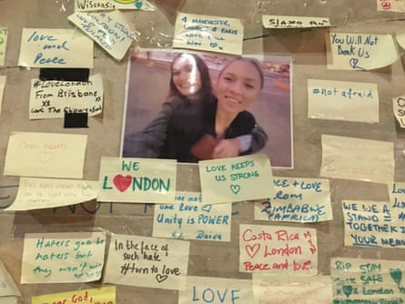 A public memorial opposite Borough Market to remember those killed in the 2017 London Bridge terror attack, showing Post-it notes with messages around a photograph
