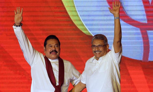 Mahinda and Gotabaya Rajapaksa wave to supporters at party convention in 2019