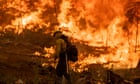 Firefighters continue battle against more than 100 blazes burning in the US