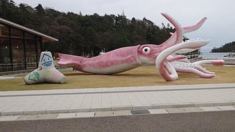 Japanese town spends Covid funds on 13-metre squid statue – video