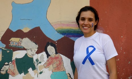 Brisa De Angulo stands by the painting she designed when she founded her centre outside Cochabamba as a teenager