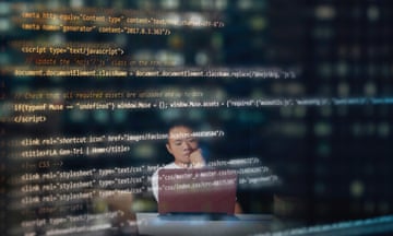 Blurred image of model on the background, thinking while programming or coding using a laptop inside an office at night with reflected codes