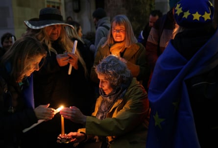 Anti-Brexit activists hold candles during a candlelight vigil organised by civil rights group New Europeans outside Europe House, central London.