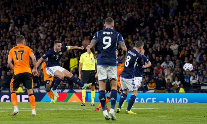 Scotland's John McGinn (second left) shoots wide.