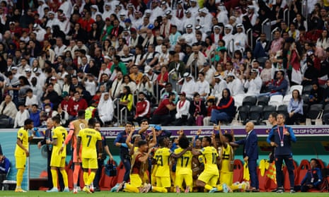 Ecuador celebrate their second goal in front of dejected Qatar fans.