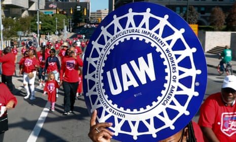 United Auto Workers members walk in the Labor Day parade in Detroit in 2019.