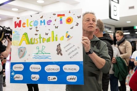 Philip McNab waits anxiously at Sydney airport to welcome a Syrian refugee family to Australia