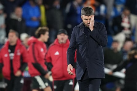 Michael Carrick covers half his face with a hand after Manchester UnitedâÂÂs defeat against Como