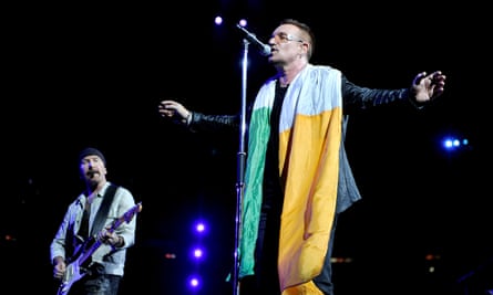 Bono draped in the Irish flag at a 2009 concert.
