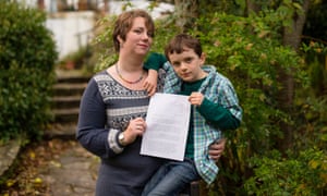 Jacob Egan with his mother and his letter to Theresa May.