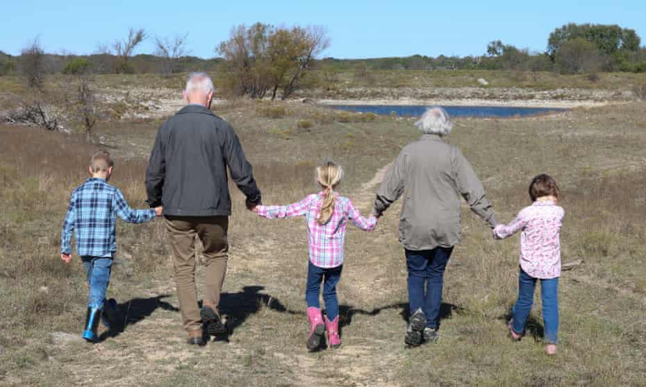 Grandparents going for a walk with their grandchildren