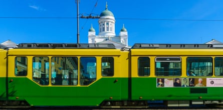 A tram goes past Helsinki Cathedral.