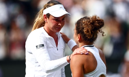 Donna Vekic is consoled by Jasmine Paolini.