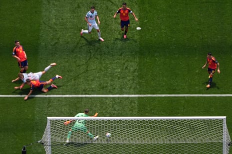 Belgium's Charles De Ketelaere heads home to equalise against Spain.