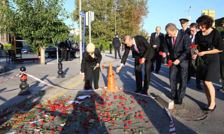 Turkey’s president, Recep Tayyip Erdoğan, visits site of bomb attack in Ankara in October.