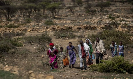 File image of people walking to a town where a humanitarian aid was available in the Tigray region of northern Ethiopia