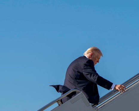 President Donald Trump is walking up a set of stairs towards an Air Force One, after Israel and the US launched strikes on Iran