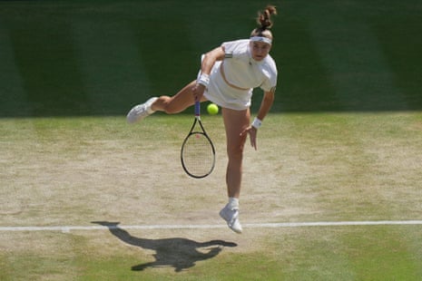 Karolina Muchova hits serve to Coco Gauff.