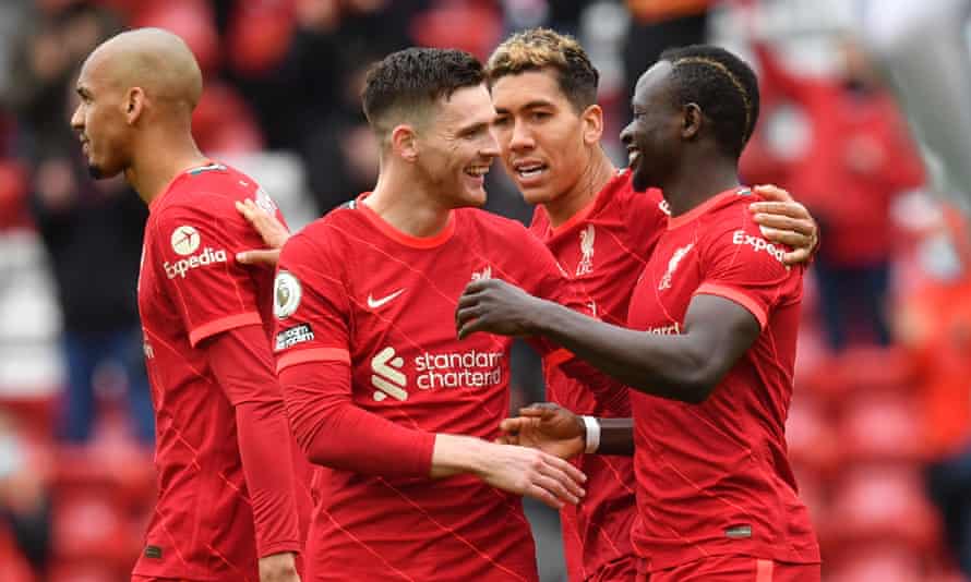 Sadio Mané (right) celebrates with Andrew Robertson and Roberto Firmino after scoring Liverpool’s second goal in the 2-0 home win over Crystal Palace.