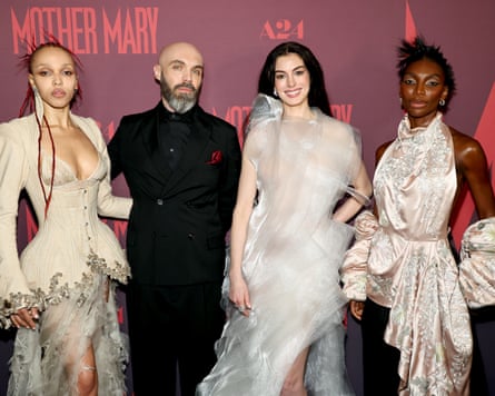 women and man on red carpet