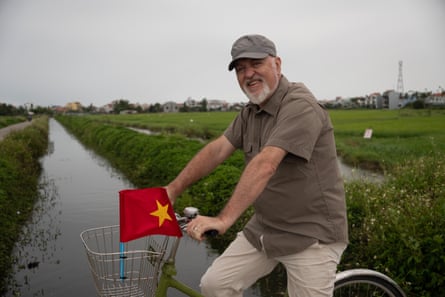 All by myself … Bailey cycles through a rice field.