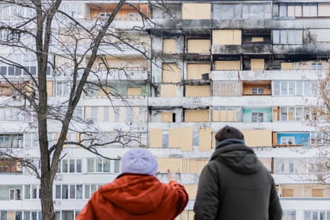 Novelist James Meek shot from the back beside an
