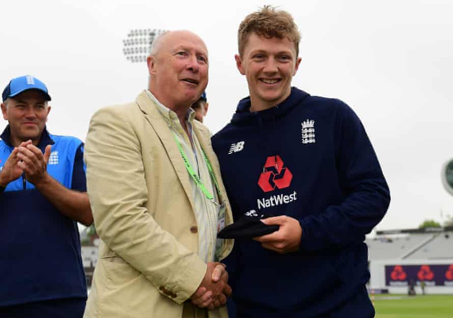Vic Marks hands Dom Bess his first test cap before the game against Pakistan at Lord's in May 2018.