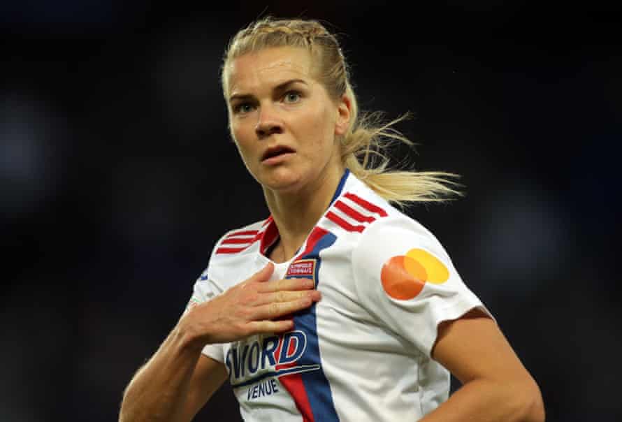 Ada Hegerberg points to the Lyon badge after scoring at the Parc des Princes.