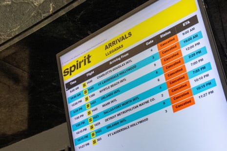 A departure board displays cancelled flights informing passengers of the shutdown of Spirit Airlines at LaGuardia Airport in Queens, in New York City.